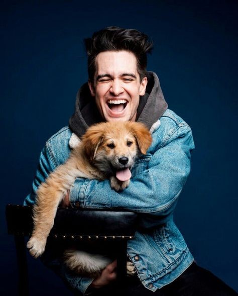 Brendon Urie Holding A Puppy